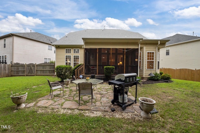 1040 Bellenden Dr, Durham, NC 27713 - rear view of property with a sunroom, a patio area, a fenced backyard, and a gate