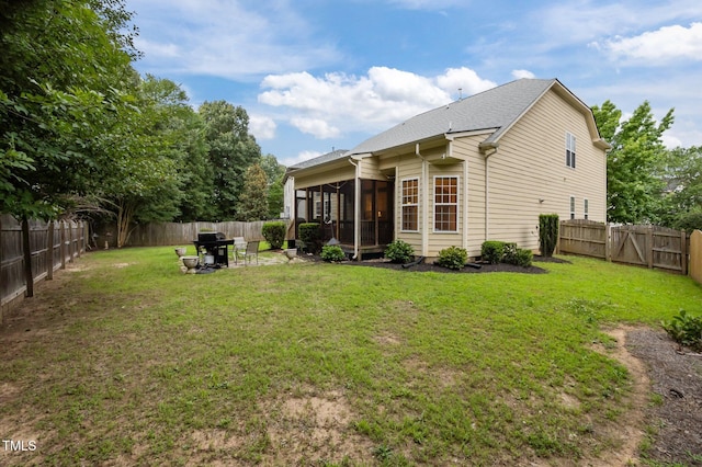 1040 Bellenden Dr, Durham, NC 27713 - rear view of property with a sunroom, a fenced backyard, and a gate