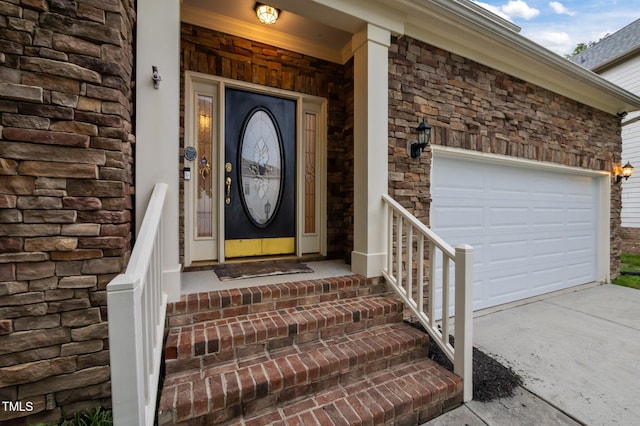 1040 Bellenden Dr, Durham, NC 27713 - property entrance featuring a garage, stone siding, and concrete driveway