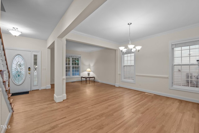 1040 Bellenden Dr, Durham, NC 27713 - foyer entrance with stairs, light wood finished floors, healthy amount of natural light, and crown molding