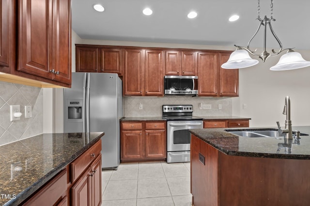 1040 Bellenden Dr, Durham, NC 27713 - kitchen featuring appliances with stainless steel finishes, tasteful backsplash, dark stone countertops, light tile patterned flooring, and recessed lighting
