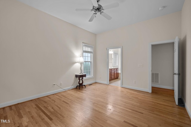 1040 Bellenden Dr, Durham, NC 27713 - unfurnished bedroom featuring light wood-type flooring, connected bathroom, and a ceiling fan