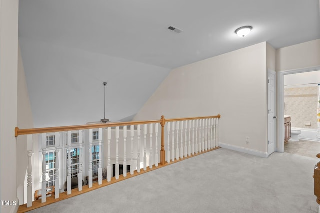1040 Bellenden Dr, Durham, NC 27713 - hallway with vaulted ceiling and carpet flooring