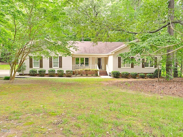 637 Shadywood Ln, Raleigh, NC 27603 - ranch-style home with a porch and a front yard