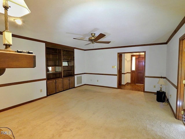 637 Shadywood Ln, Raleigh, NC 27603 - unfurnished room with light carpet, a ceiling fan, ornamental molding, and built in shelves