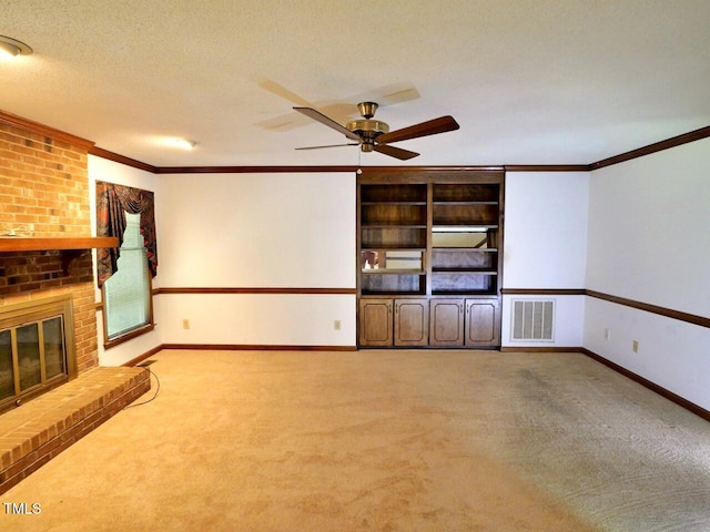 637 Shadywood Ln, Raleigh, NC 27603 - unfurnished living room featuring carpet, crown molding, a brick fireplace, a ceiling fan, and a textured ceiling