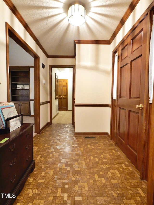 637 Shadywood Ln, Raleigh, NC 27603 - hallway with a textured ceiling and ornamental molding