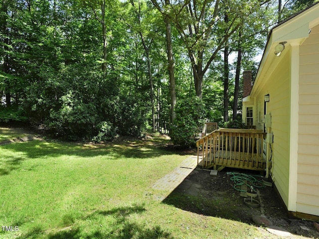 637 Shadywood Ln, Raleigh, NC 27603 - view of green lawn with a deck