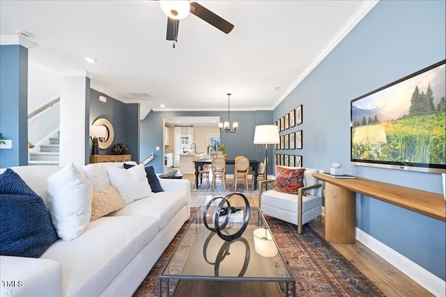 549 Forestville Rd, Wake Forest, NC 27587 - living room with a ceiling fan, wood finished floors, stairway, a chandelier, and ornamental molding