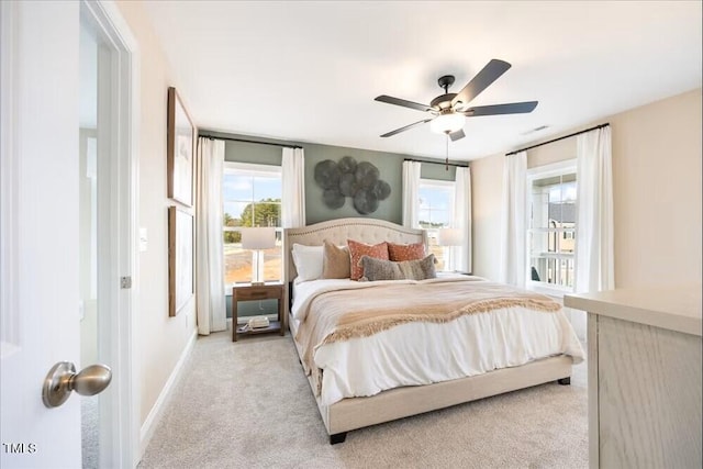549 Forestville Rd, Wake Forest, NC 27587 - bedroom with light carpet, multiple windows, and ceiling fan