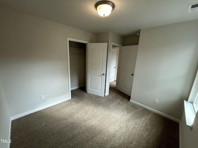 201 W Railroad St, Robersonville, NC 27871 - unfurnished bedroom with carpet and a closet