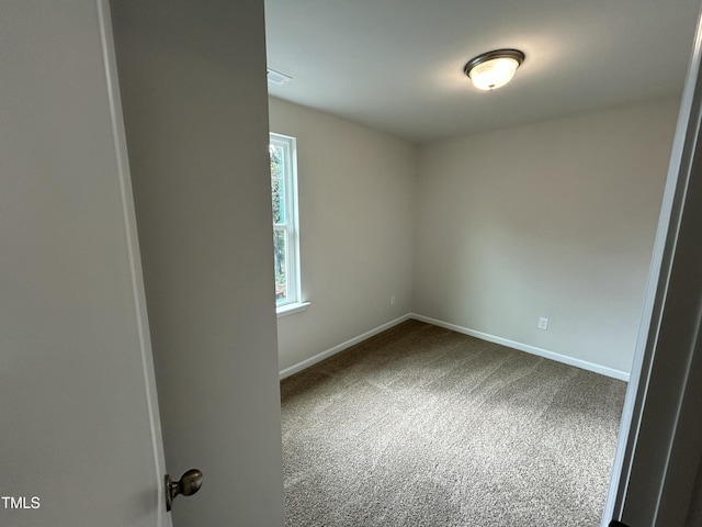 201 W Railroad St, Robersonville, NC 27871 - carpeted spare room featuring baseboards
