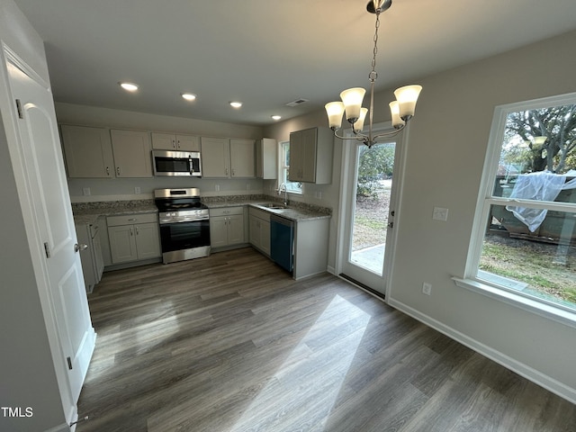 201 W Railroad St, Robersonville, NC 27871 - kitchen with stainless steel appliances, a chandelier, recessed lighting, wood finished floors, and hanging light fixtures