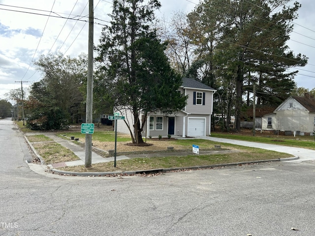 201 W Railroad St, Robersonville, NC 27871 - view of property hidden behind natural elements featuring driveway and a garage