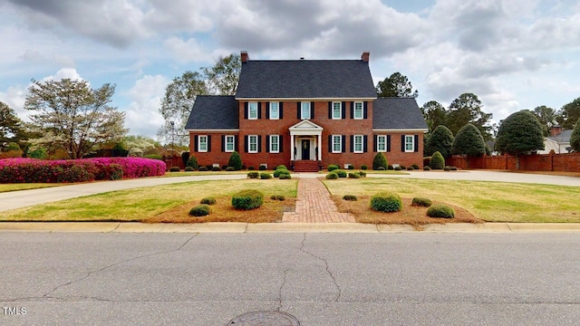 604 Hillcrest Pl, Goldsboro, NC 27534 - view of front of house with a chimney and brick siding