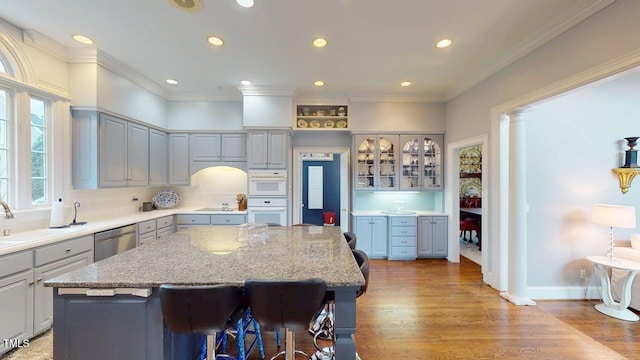 604 Hillcrest Pl, Goldsboro, NC 27534 - kitchen featuring stainless steel dishwasher, a center island, recessed lighting, gray cabinets, and light wood-style flooring
