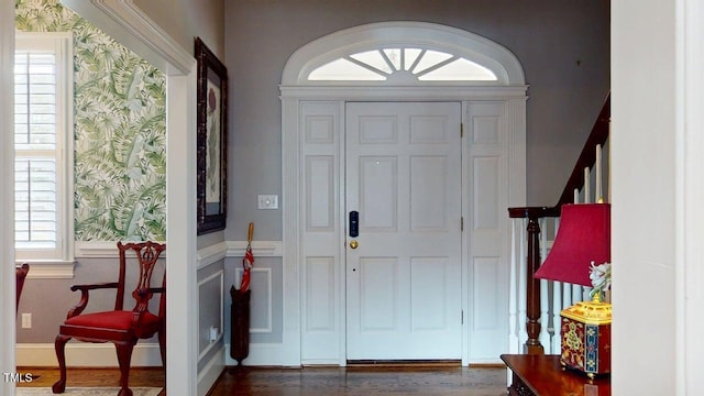 604 Hillcrest Pl, Goldsboro, NC 27534 - foyer with healthy amount of natural light, wood finished floors, stairway, and wallpapered walls