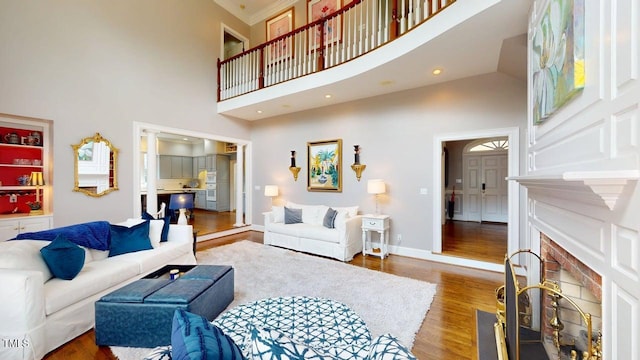 604 Hillcrest Pl, Goldsboro, NC 27534 - living area with a towering ceiling, wood finished floors, and a fireplace