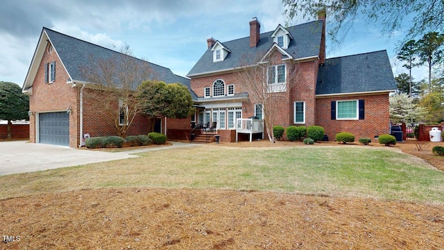 604 Hillcrest Pl, Goldsboro, NC 27534 - view of front facade featuring brick siding, a garage, a front lawn, concrete driveway, and a chimney