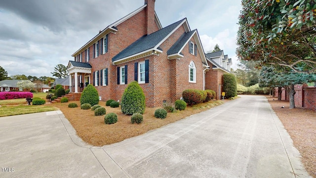 604 Hillcrest Pl, Goldsboro, NC 27534 - view of side of property featuring brick siding and a chimney