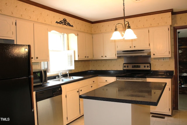 2071 Meadow Ln, Graham, NC 27253 - kitchen featuring stainless steel appliances, under cabinet range hood, dark countertops, ornamental molding, and a center island