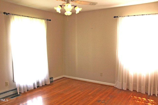 2071 Meadow Ln, Graham, NC 27253 - empty room with ceiling fan and wood finished floors