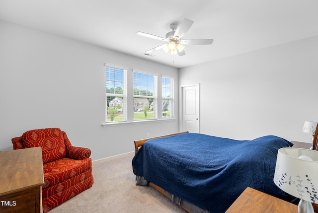 7117 Crested Iris Pl, Durham, NC 27703 - carpeted bedroom with baseboards and ceiling fan