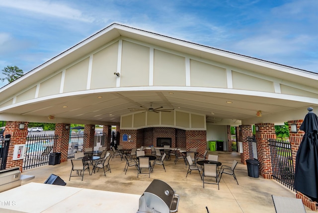 7117 Crested Iris Pl, Durham, NC 27703 - view of patio featuring a ceiling fan, a gazebo, and a fireplace