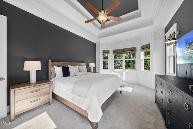 1325 Mackinaw Dr, Wake Forest, NC 27587 - bedroom with multiple windows, light carpet, a ceiling fan, a raised ceiling, and ornamental molding