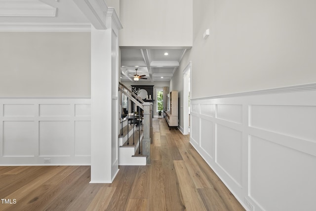 1325 Mackinaw Dr, Wake Forest, NC 27587 - corridor with a decorative wall, stairs, coffered ceiling, wood finished floors, and crown molding