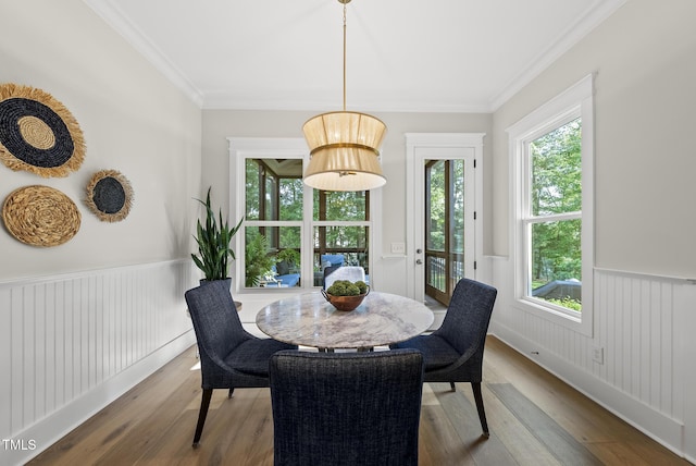 1325 Mackinaw Dr, Wake Forest, NC 27587 - dining area with wood finished floors, crown molding, and a wainscoted wall