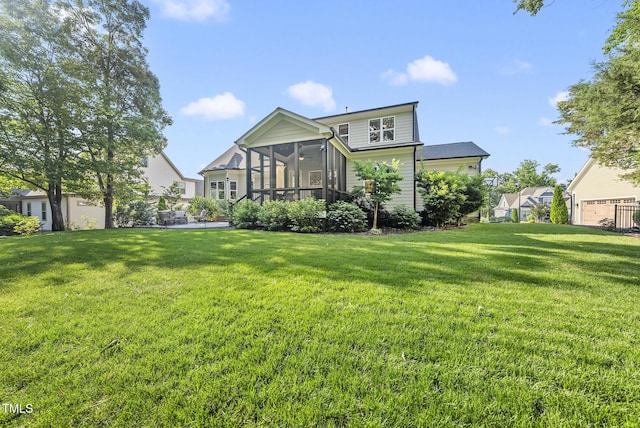 1325 Mackinaw Dr, Wake Forest, NC 27587 - rear view of house featuring a lawn and a sunroom