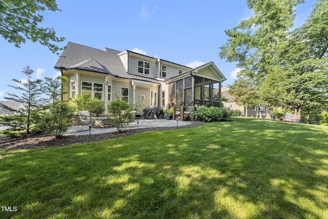1325 Mackinaw Dr, Wake Forest, NC 27587 - back of property with a patio area, a sunroom, a yard, and roof with shingles