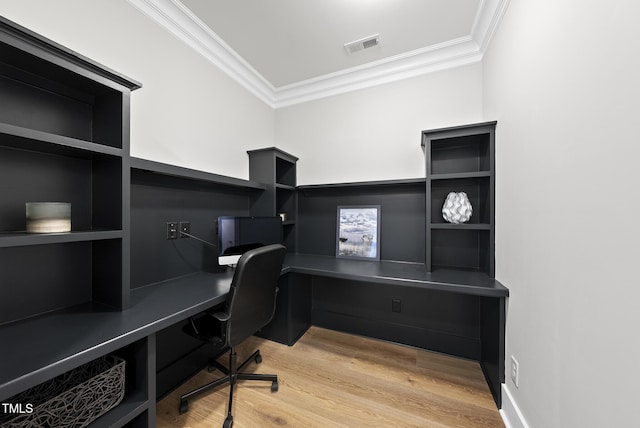 1325 Mackinaw Dr, Wake Forest, NC 27587 - home office with crown molding, built in study area, and light wood-style flooring
