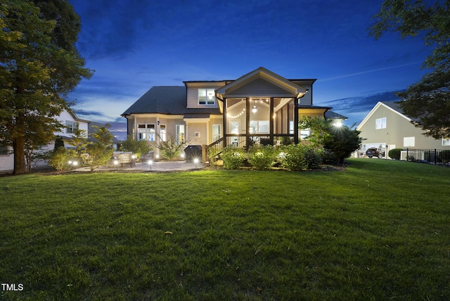 1325 Mackinaw Dr, Wake Forest, NC 27587 - view of front of home featuring a front lawn and a sunroom