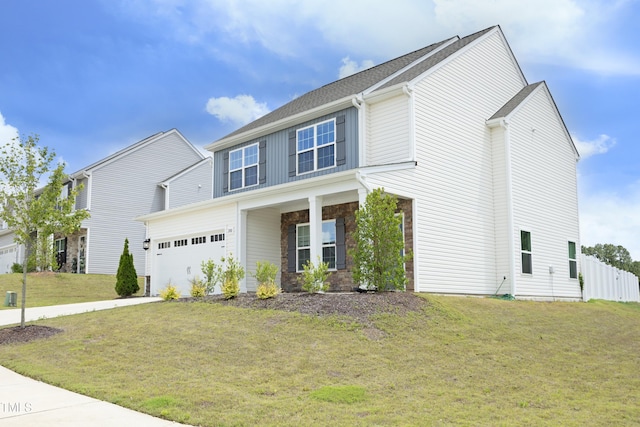 200 Sweet Violet Dr, Youngsville, NC 27596 - view of front of property with a garage, stone siding, and driveway