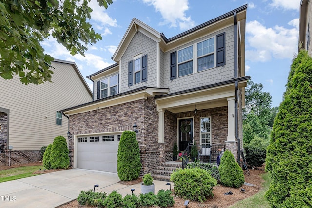 1020 Regency Cottage Pl, Cary, NC 27518 - craftsman-style home with an attached garage, covered porch, and driveway