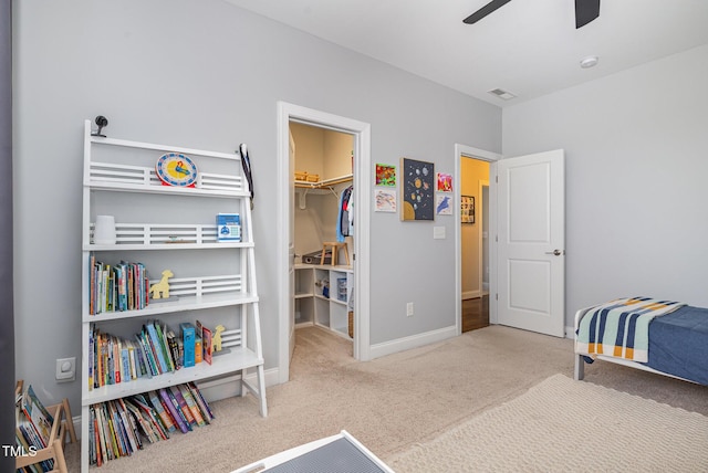 1020 Regency Cottage Pl, Cary, NC 27518 - carpeted bedroom featuring a walk in closet, a closet, and ceiling fan