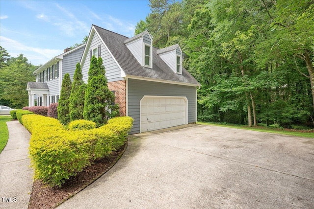 2008 Corberrie Ln, Raleigh, NC 27613 - view of property exterior featuring brick siding, a garage, and roof with shingles