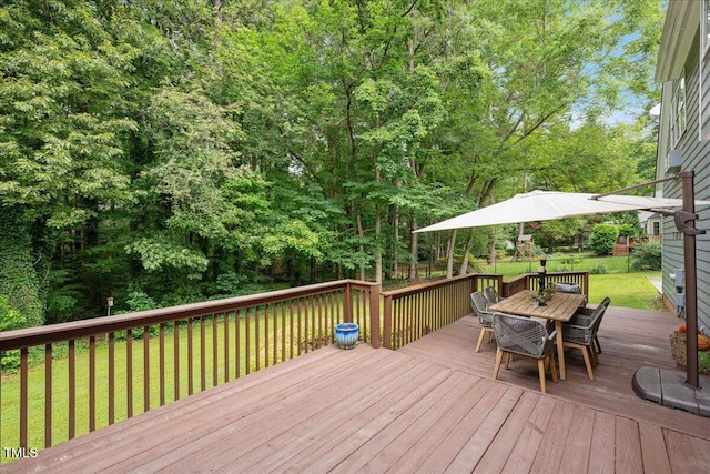 2008 Corberrie Ln, Raleigh, NC 27613 - wooden terrace featuring outdoor dining area, a lawn, and a playground