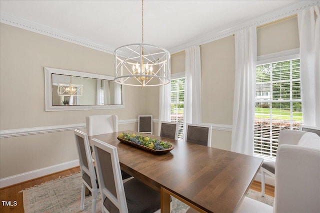 2008 Corberrie Ln, Raleigh, NC 27613 - dining room with a chandelier, plenty of natural light, wood finished floors, and ornamental molding