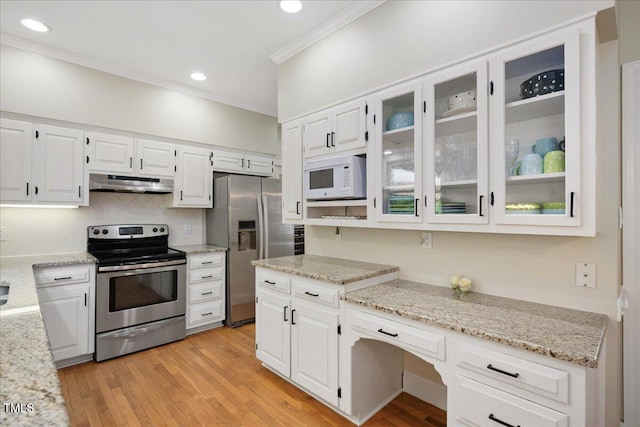 2008 Corberrie Ln, Raleigh, NC 27613 - kitchen featuring appliances with stainless steel finishes, under cabinet range hood, crown molding, white cabinetry, and light stone counters