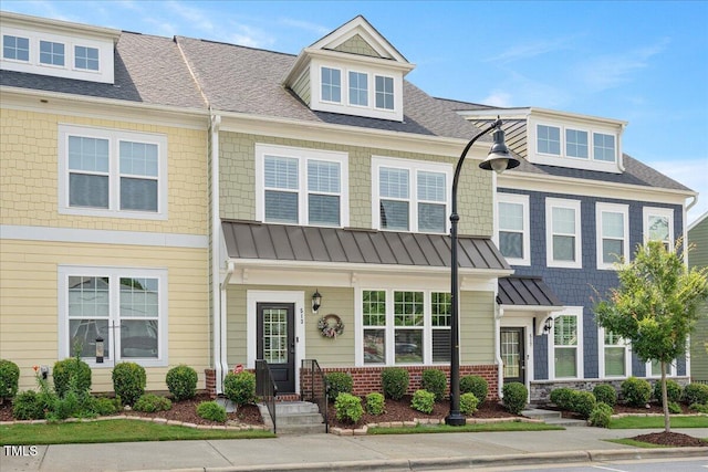 513 Brooks St, Wake Forest, NC 27587 - view of property featuring a standing seam roof, roof with shingles, and a metal roof