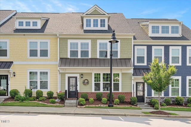 513 Brooks St, Wake Forest, NC 27587 - view of property with a standing seam roof, roof with shingles, and a metal roof