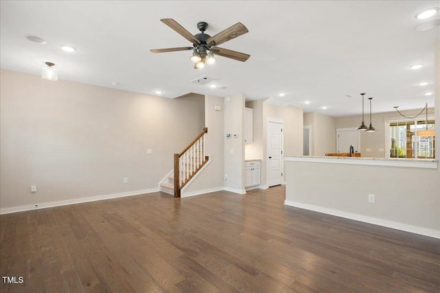 513 Brooks St, Wake Forest, NC 27587 - unfurnished living room with dark wood finished floors, a ceiling fan, stairs, and recessed lighting