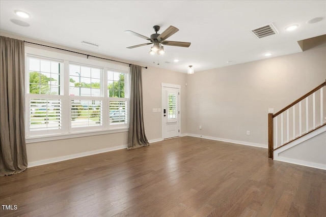 513 Brooks St, Wake Forest, NC 27587 - unfurnished living room featuring ceiling fan, wood finished floors, stairs, and recessed lighting