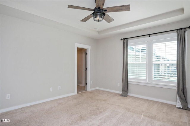 513 Brooks St, Wake Forest, NC 27587 - carpeted empty room featuring a tray ceiling and a ceiling fan