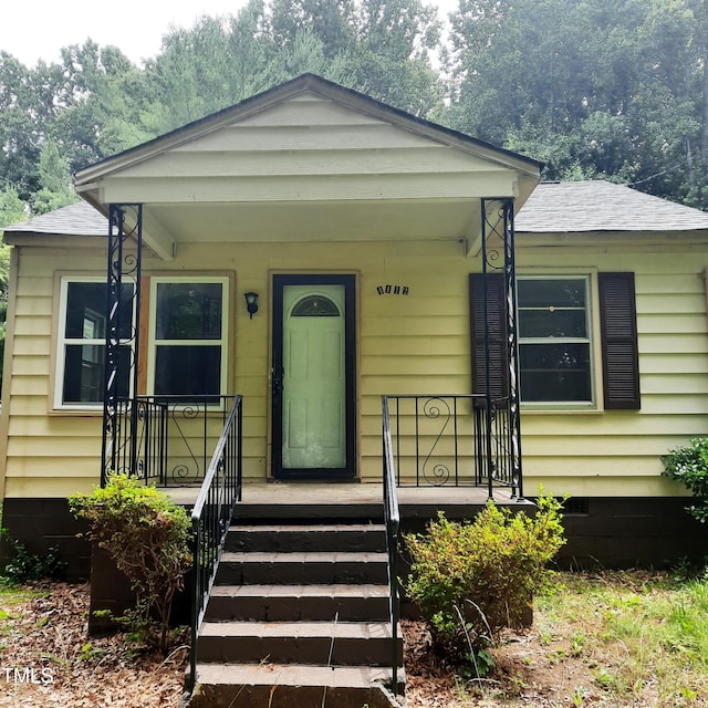 4112 Forrest Ave, Efland, NC 27243 - view of front of home with a shingled roof and a porch