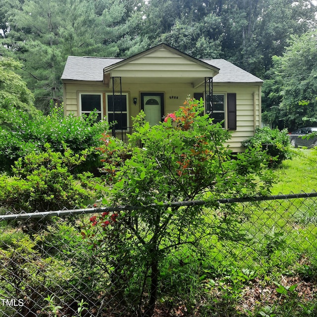 4112 Forrest Ave, Efland, NC 27243 - view of front of property featuring a view of trees and roof with shingles