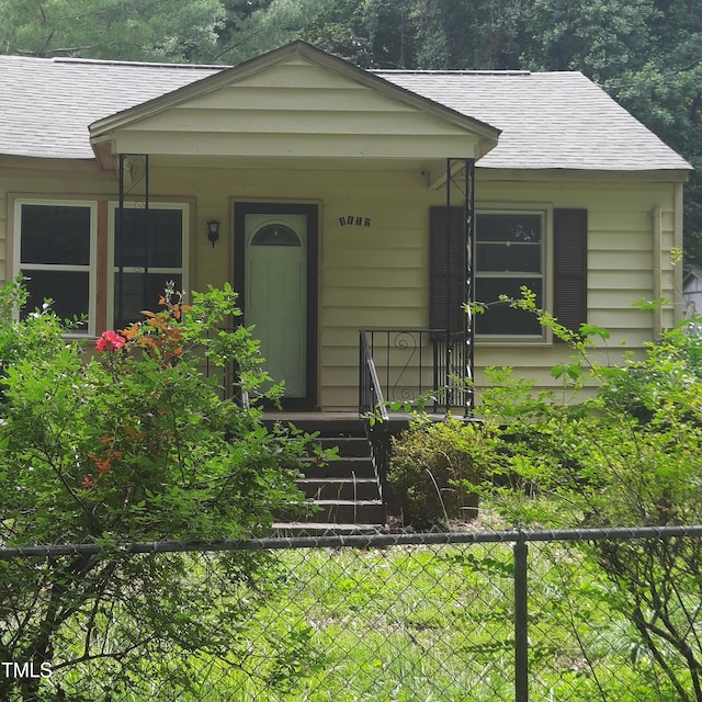 4112 Forrest Ave, Efland, NC 27243 - bungalow featuring a shingled roof and covered porch